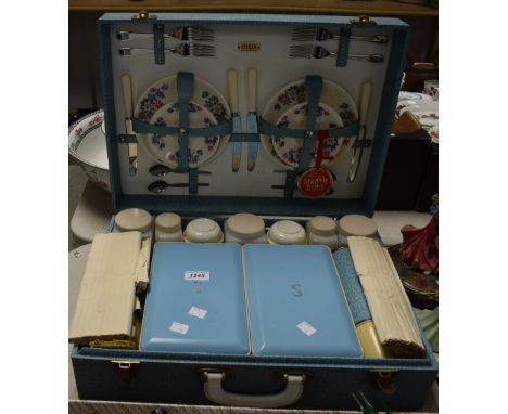 A 1960s Sirram picnic hamper, fully fitted with flasks, jars, sandwich boxes, plates, cutlery, cups, etc