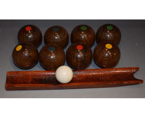 A set of wooden carpet bowls