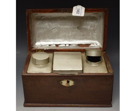 A George II mahogany tea caddy, fitted with three Toleware canisters