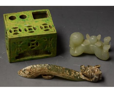 A Chinese jade carving; another; a ceramic spinach jade coloured pen stand (3)