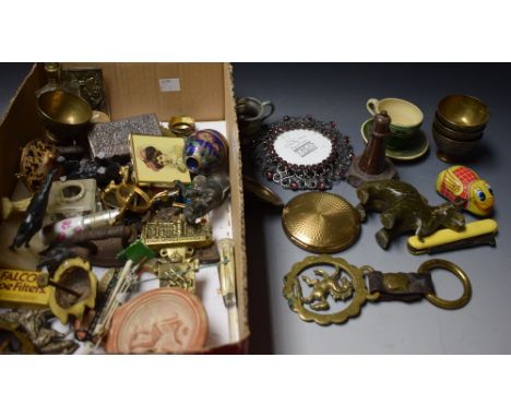 A silver cover with blue engine turned enamel mount; a powder compact; brass miniature bowls; a clockwork chick; a serpentine