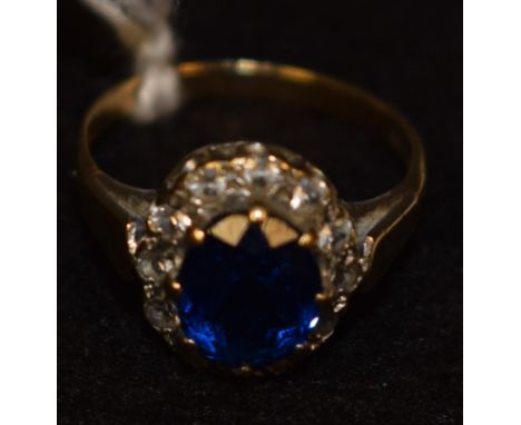 A synthetic blue spinel and cubic zirconia cluster ring, 9ct gold shank, 2.7g gross