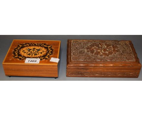 A carved wood playing card box; a musical cigarette box (2)