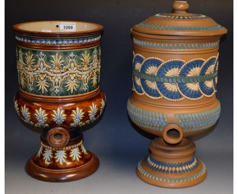 A Doulton Silicon Lambeth water filter, applied in relief with band of over lapping roundels, in tones of blue and white on a