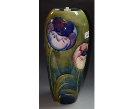 A Moorcroft Poppy pattern ovoid lamp basetubelined with large flowerheads on a green ground, 35.5cm high,  impressed marks,si