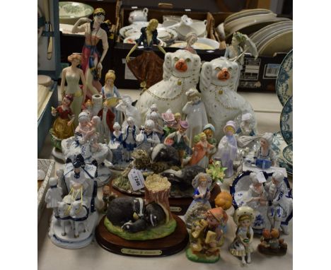 A pair of Staffordshire spaniel mantels, C.1860; continental porcelain figures, various; Goebel type figures; resin ladies; e