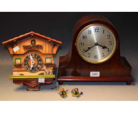 A mahogany domed mantel clock, silvered circular dial set with Arabic numerals; a cuckoo clock (2)