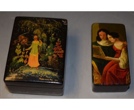 A Victorian rounded rectangular papier-mâché snuff box, the hinged cover painted with a 17th century couple of title examinin