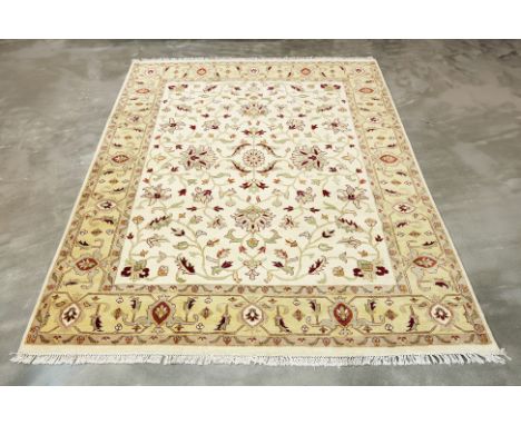AN AFGHAN SULTANABAD WOOL CARPET (306 x 246cm)
Hand knotted wool with scrolling flowers and foliage on a cream field
Conditio
