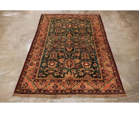 A TURKMEN WOOL CARPET (300 x 210cm)
Hand knotted wool pile, circa 1980, elaborate stylised foliate design
Condition: For a co