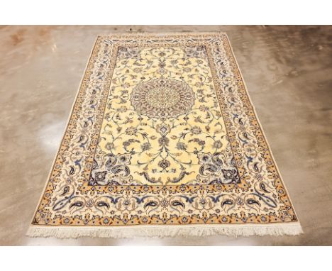 A NAIN WOOL AND SILK CARPET (322 x 203cm)
Hand knotted wool with 30% silk, medallion design
Condition: For a condition report