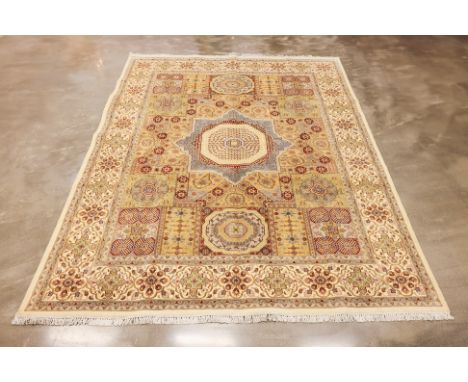 A PAKISTANI MAMLUK WOOL CARPET (317 x 243cm)
Hand knotted wool, intricate design with central star shaped medallion
Condition