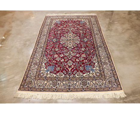 A NAIN WOOL AND SILK CARPET (315 x 203cm)
Hand knotted wool with 30% silk, medallion design on a burgundy field
Condition: Fo