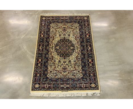 A PAK PERSIAN WOOL CARPET (147 x 93cm) Hand knotted wool, fine foliate design by Rasheed family, signed Condition: For a cond