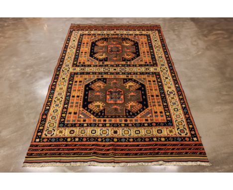 A CAUCASIAN SHIRWAN WOOL CARPET (315 x 196cm)
Circa 1940s, hand knotted wool pile, of double medallion design
Condition: For 