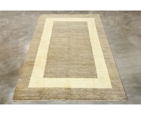 A CONTEMPORARY WOOL CARPET (294 x 198cm)
Hand knotted wool, small checkered design with cream border
Condition: For a conditi