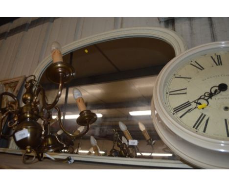 An arch framed overmantel mirror 