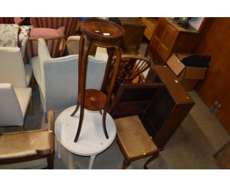 An Edwardian mahogany two tier plant stand; a French style circular topped coffee table; and a cane seated stool