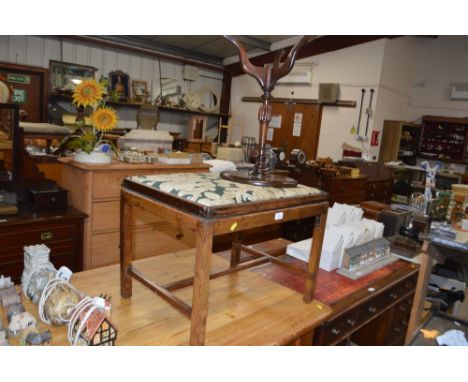 A mahogany upholstered stool/ luggage stand; and a reproduction mahogany wine table