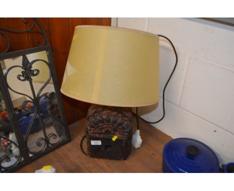 An ornate carved wooden table lamp and shade 