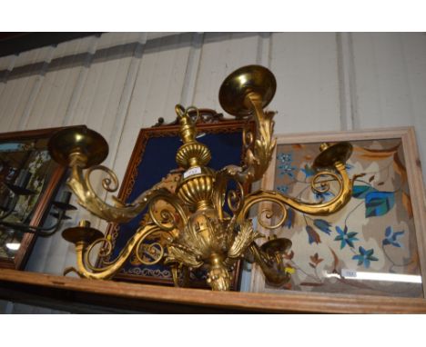 A heavy gilt metal five branch chandelier