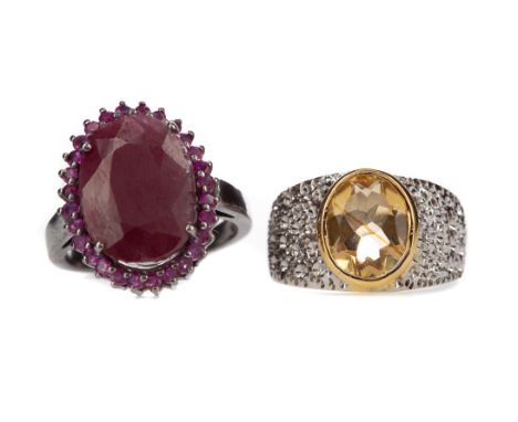 RUBY RING, set with an oval ruby of approximately 12.90 carats, along with a citrine ring, each in silver, each size N