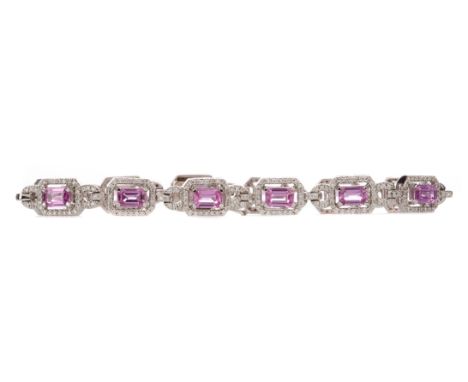 PINK SAPPHIRE AND DIAMOND BRACELET, the step cut pink sapphires within round brilliant cut diamond halos, the pink sapphires 
