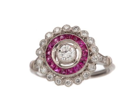 RUBY AND DIAMOND TARGET RING, the central old cut diamond of approximately 0.30 carats, within a border of calibre cut rubies