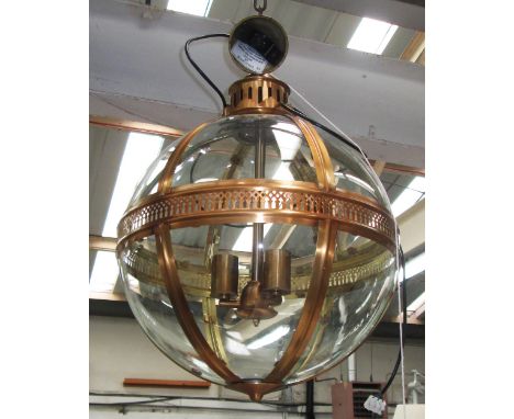 GLOBE LANTERN, contemporary bronze with glass panes and three centre lights, 63cm H x 48cm W. 