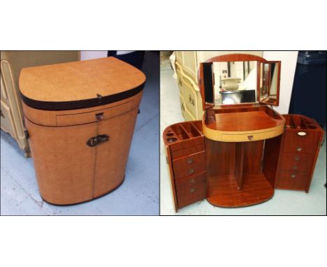 STARBAY COMPACTUM DRESSING TABLE, light tanned leather with a rising top enclosing a mirror and multiple drawers, (bears plaq