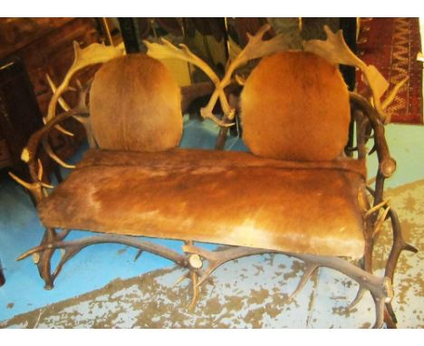 ANTLER SOFA, late 20th/early 21st century with deer hide back and seat, 161cm W x 78cm D x 96cm H. 