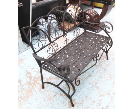 GARDEN BENCH, two seater, in brown iron floral design, 114cm L. 