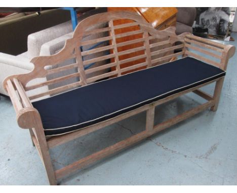 GARDEN BENCH, Lutyens style, with a slatted back, sides and seat having a loose navy blue cushion, bears the name 'Hard Woods