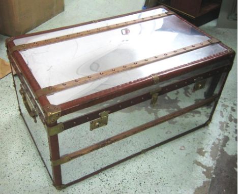 TRAVELLING TRUNK, aluminium clad with leather bindings and wooden slats, 86cm W x 52.5cm D x 46cm H. 
