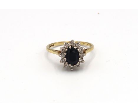 An 18ct yellow gold sapphire and diamond cluster ring, size P/Q, approx 3.75 grams 