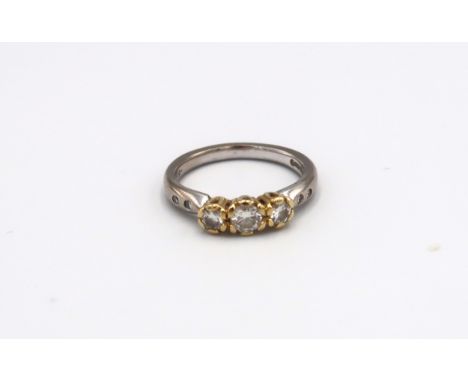 An 18ct white and yellow gold diamond seven stone ring size M 1/2 - approx weight 4.52 grams 