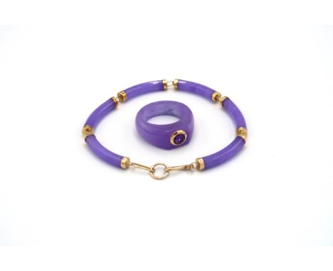 An amethyst ring size T 1/2. Stamped 14K. Weight 8.22grams. An amethyst panel bracelet. Tests 14K. Weight 11.11 grams