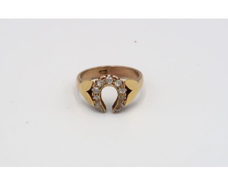 An 18ct yellow gold (tested) diamond horseshoe ring size U 1/2, total weight approx 6.63 grams 