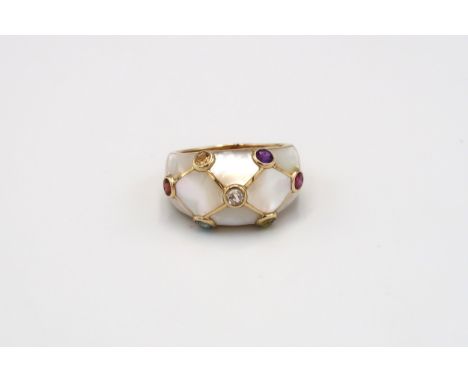 A mother of pearl bombe style ring with seven stone collets. Stamped 14K. Size U. Weight 6.18 grams. 