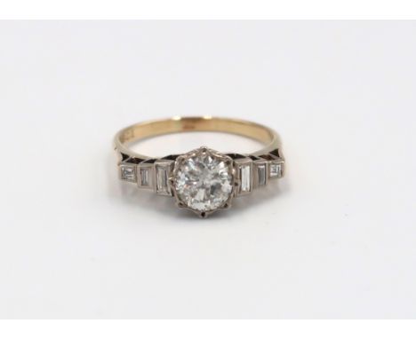 A 9ct and 18ct Yellow Gold Diamond ring, Centre stone approx. 1.25ct with six baguette cut diamonds to shoulder, Head size ap