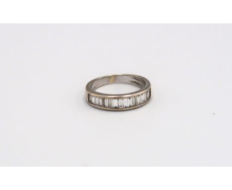 An 18ct yellow gold eternity ring with baguette cut diamonds to shoulder, size K, approx 3.4 grams 