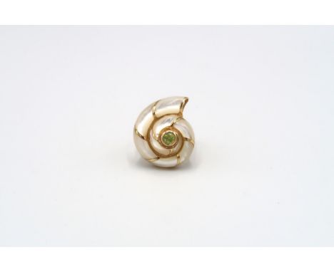 A ring in the form of a mother of pearl conch shell, with green central stone. Stamped 585. Ring size Q 1/2. Weight 5.54 gram