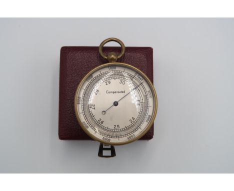 A brass cased compensated barometer, no makers mark, in outer case 
