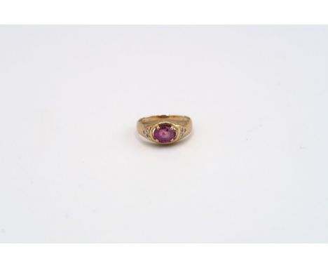 A pink sapphire and diamond dress ring. Size K 1/2. Stamped 14K. Weight approx 2.58 grams. 