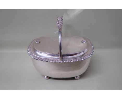 A hallmarked silver tea caddy, foliate decorated handle with gadrooned border to top, London date and maker indistinct, 22.62