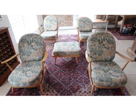 A set of four Ercol Windsor armchairs and footstool 