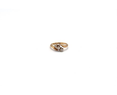 An 18ct old cut diamond three stone crossover ring. Size M. Weight approx 2.79 grams 