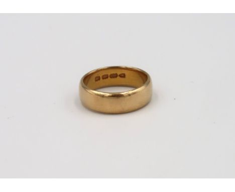 A 22ct gold band ring. Size M. Weight approx 7.21 grams 