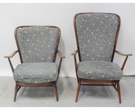 A set of Ercol 'His and Hers' cottage armchairs in mid stained beech with floral blue ground loose cushions, height of 'His' 