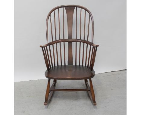An Ercol country-style rocker in mid stained beech, height 101.5cm.